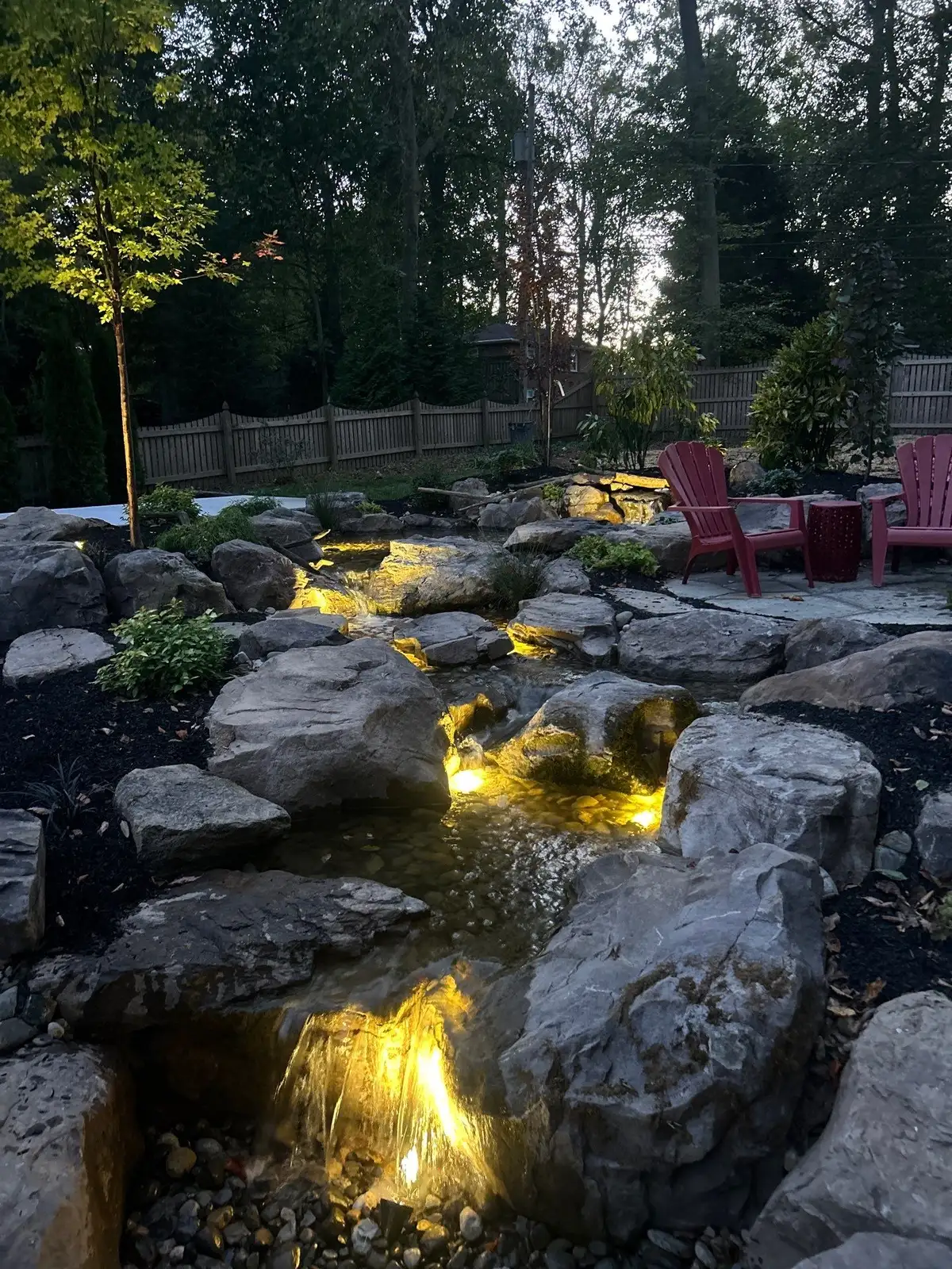 Garden water feature near planting bed