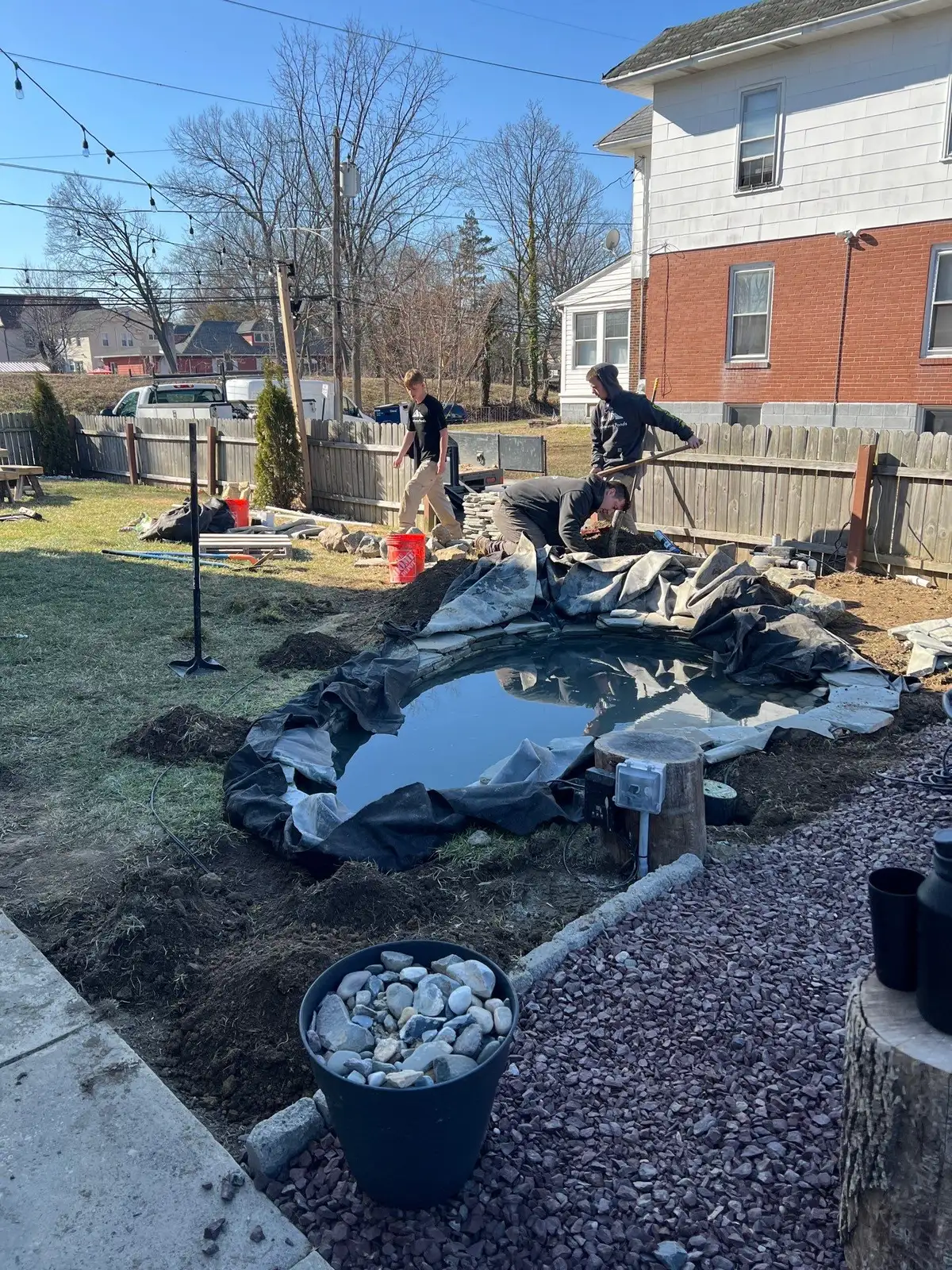 Completed ecosystem pond with waterfall feature in Delaware
