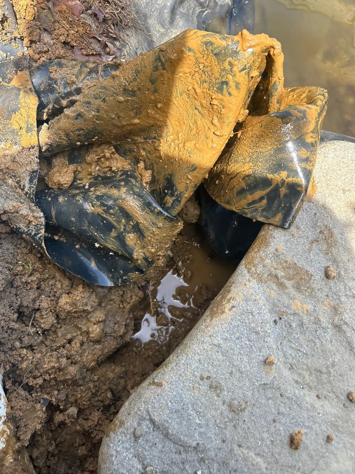 Completed leak repair on pond liner with verified seal