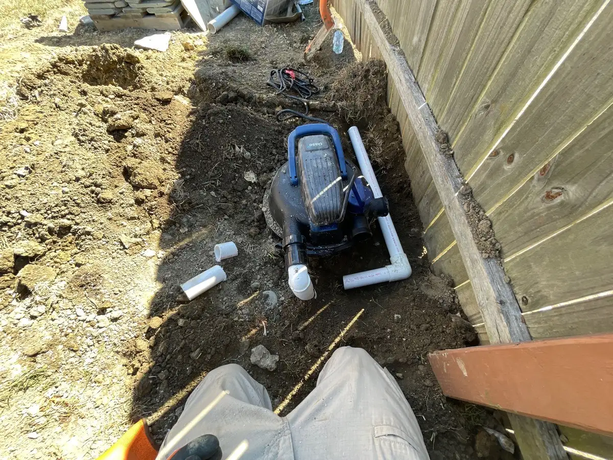 Pond construction with stone retaining wall and cascading water