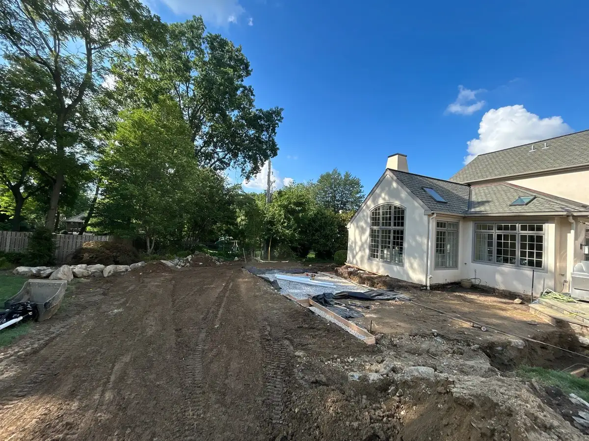 Pondless waterfall feature with natural stone in woodland setting